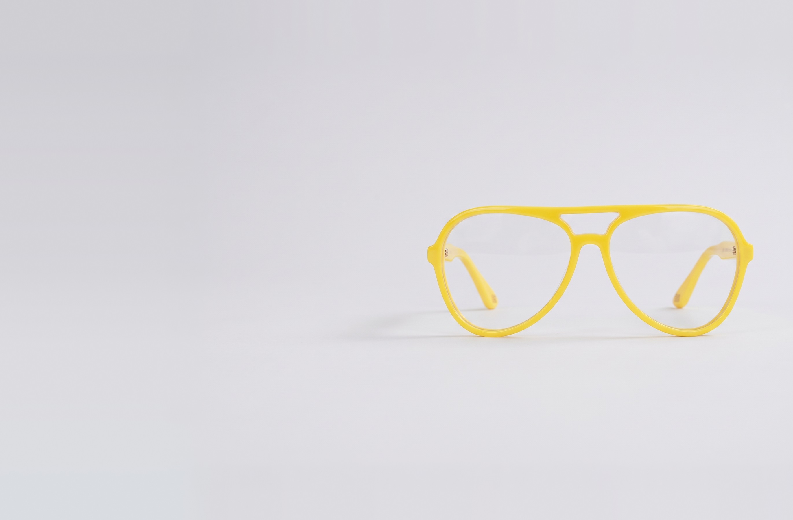 The Aviator in Yellow, face on, with clear lenses. Touch a colour to tint them