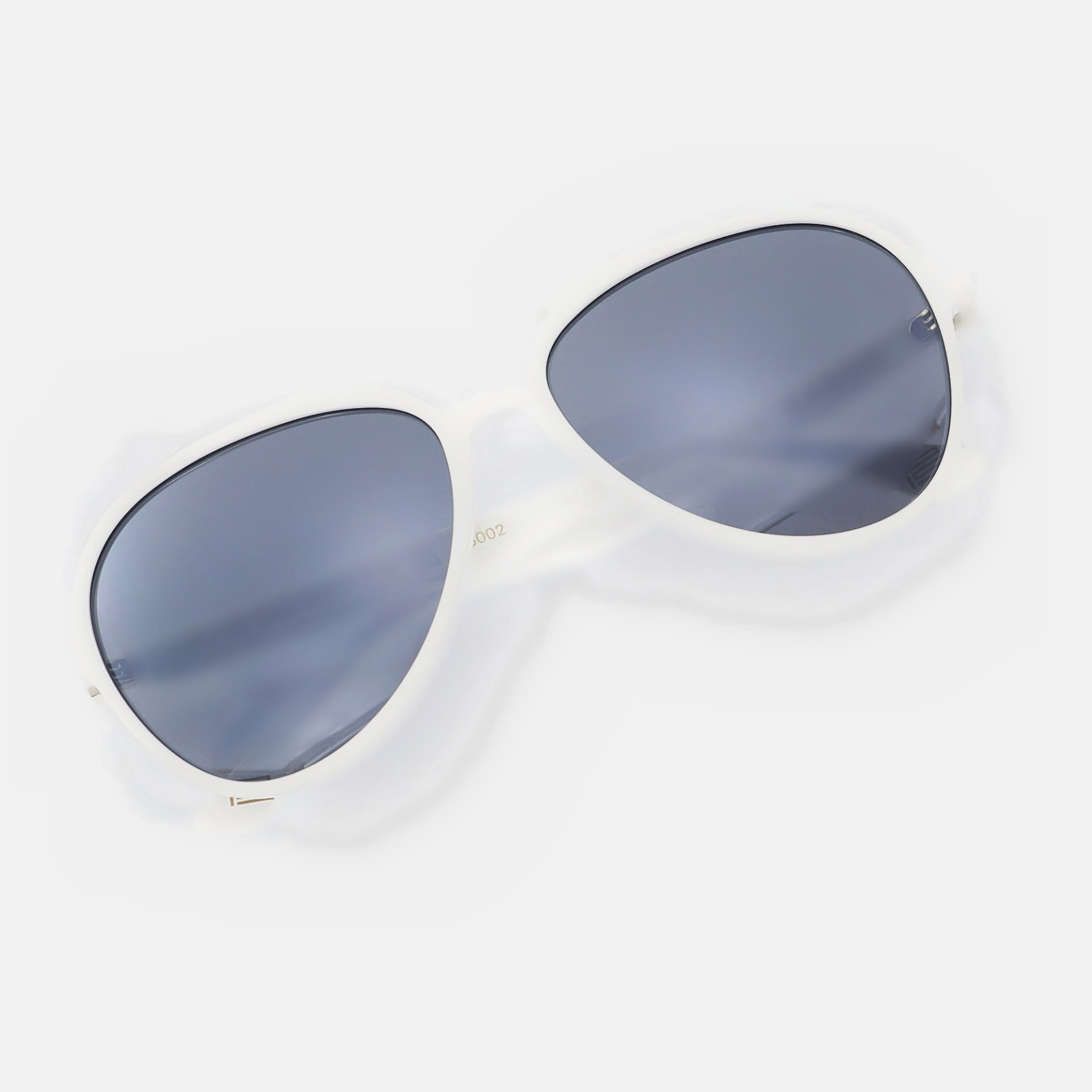 The Aviator in Bone — cream acetate, mirrored lenses, slotted bridge and gold hinges