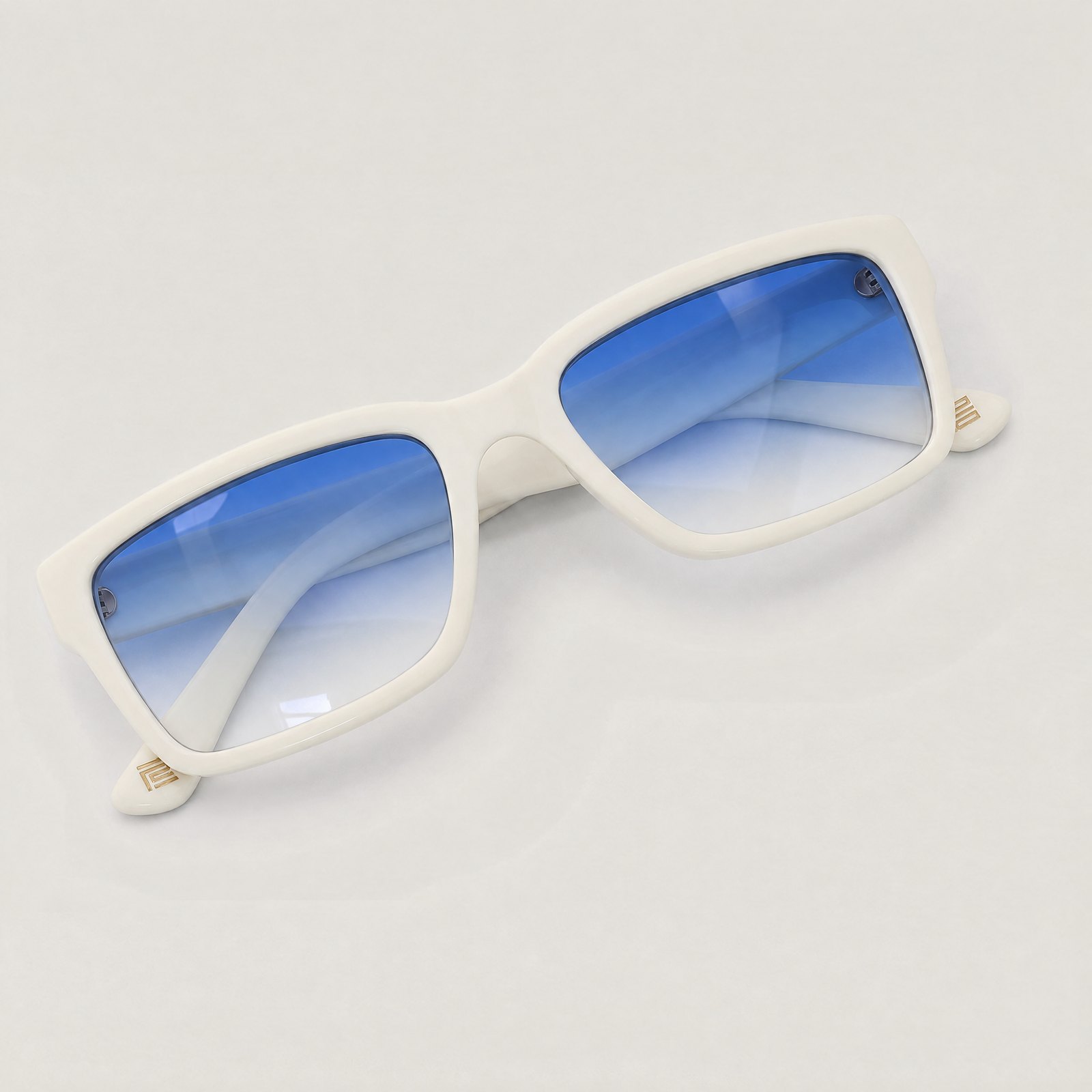 The Square in Ivory with prescription lenses tinted in a sapphire to clear gradient