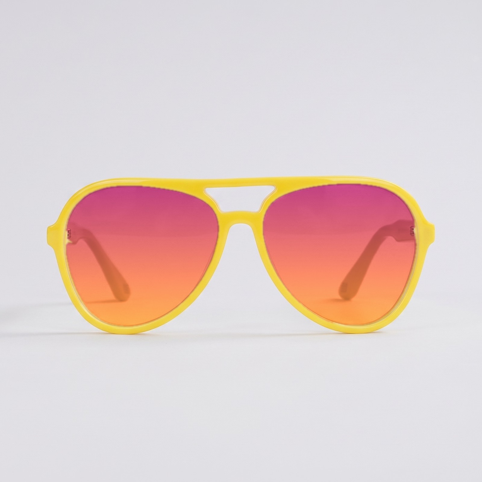 The Aviator in Yellow with prescription lenses tinted in a rose to amber gradient